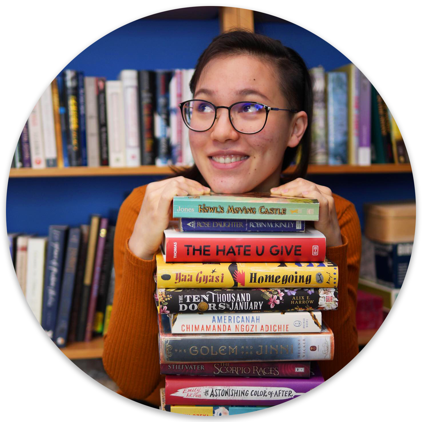 Anja Hendrikse Liu with a stack of books