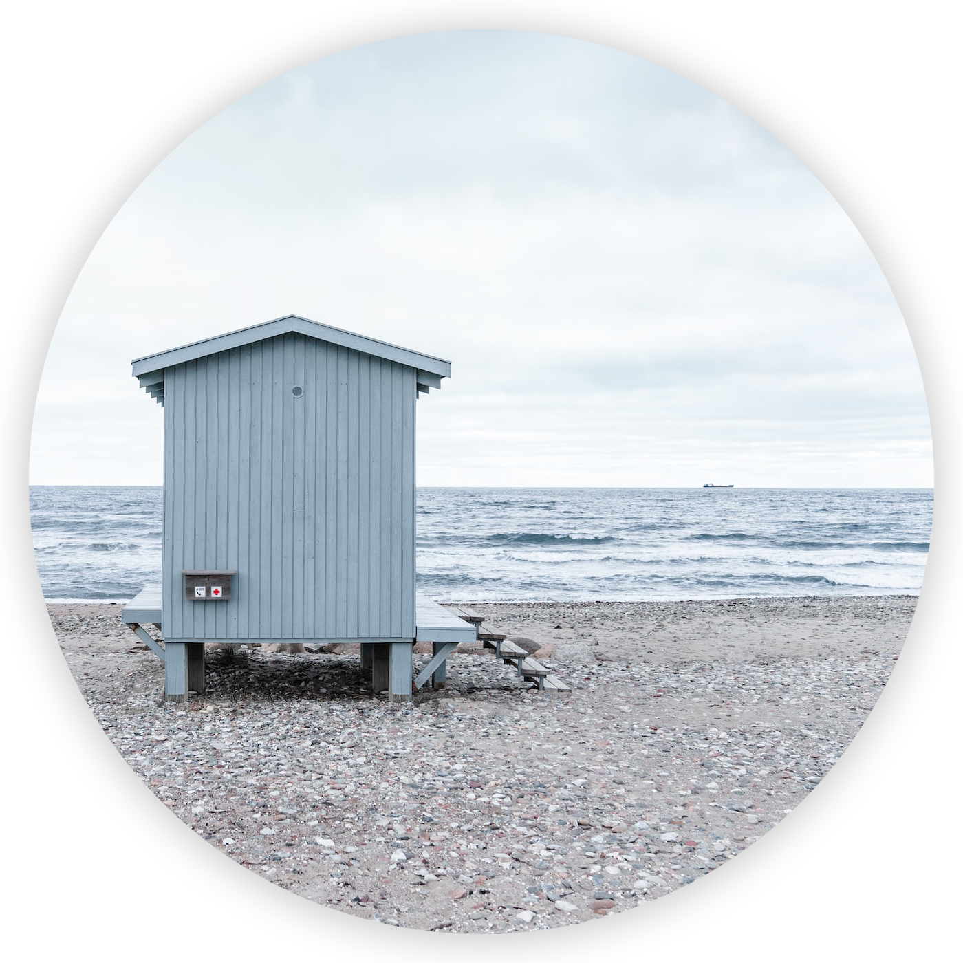 A wooden hut on a beach by the ocean