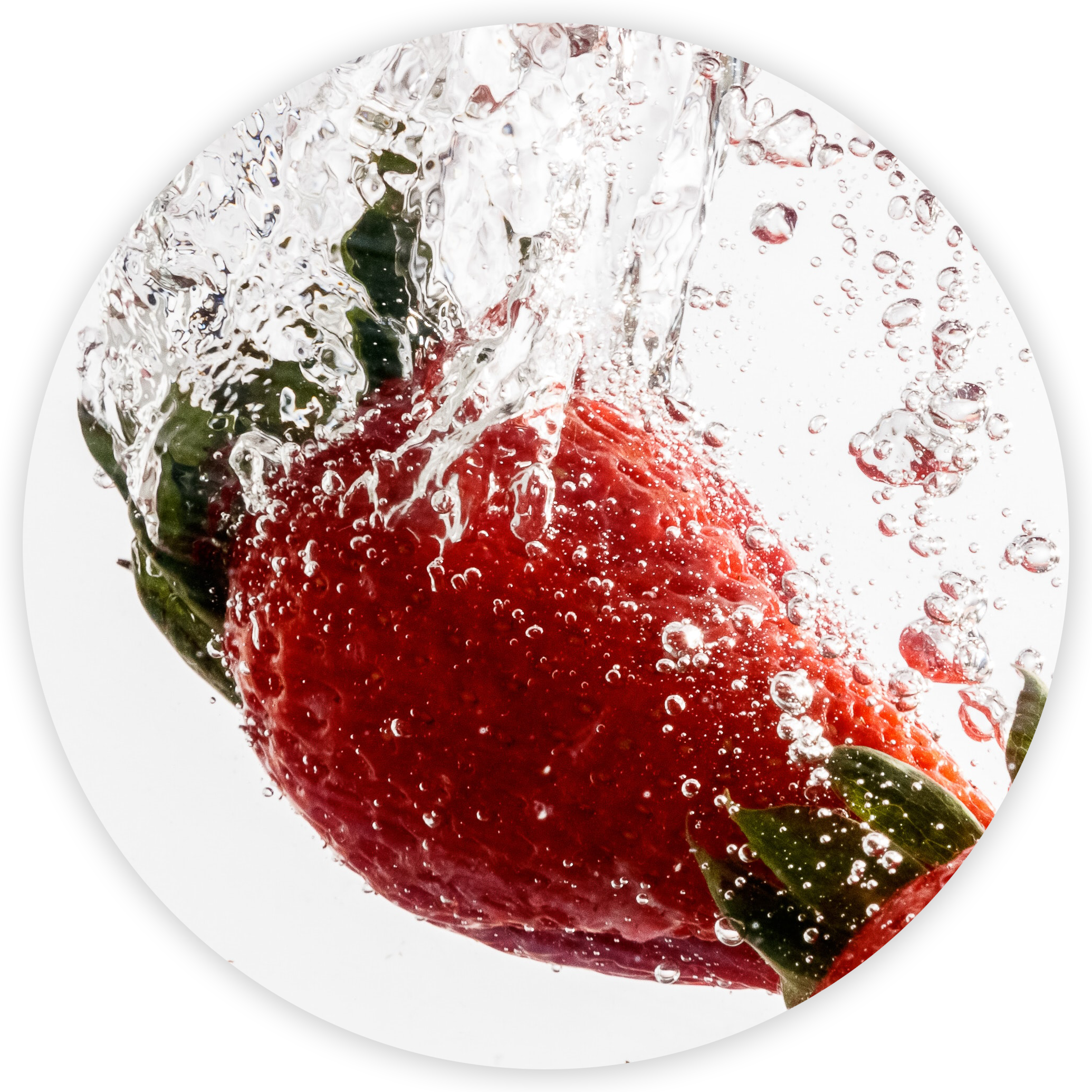 A strawberry falling into water